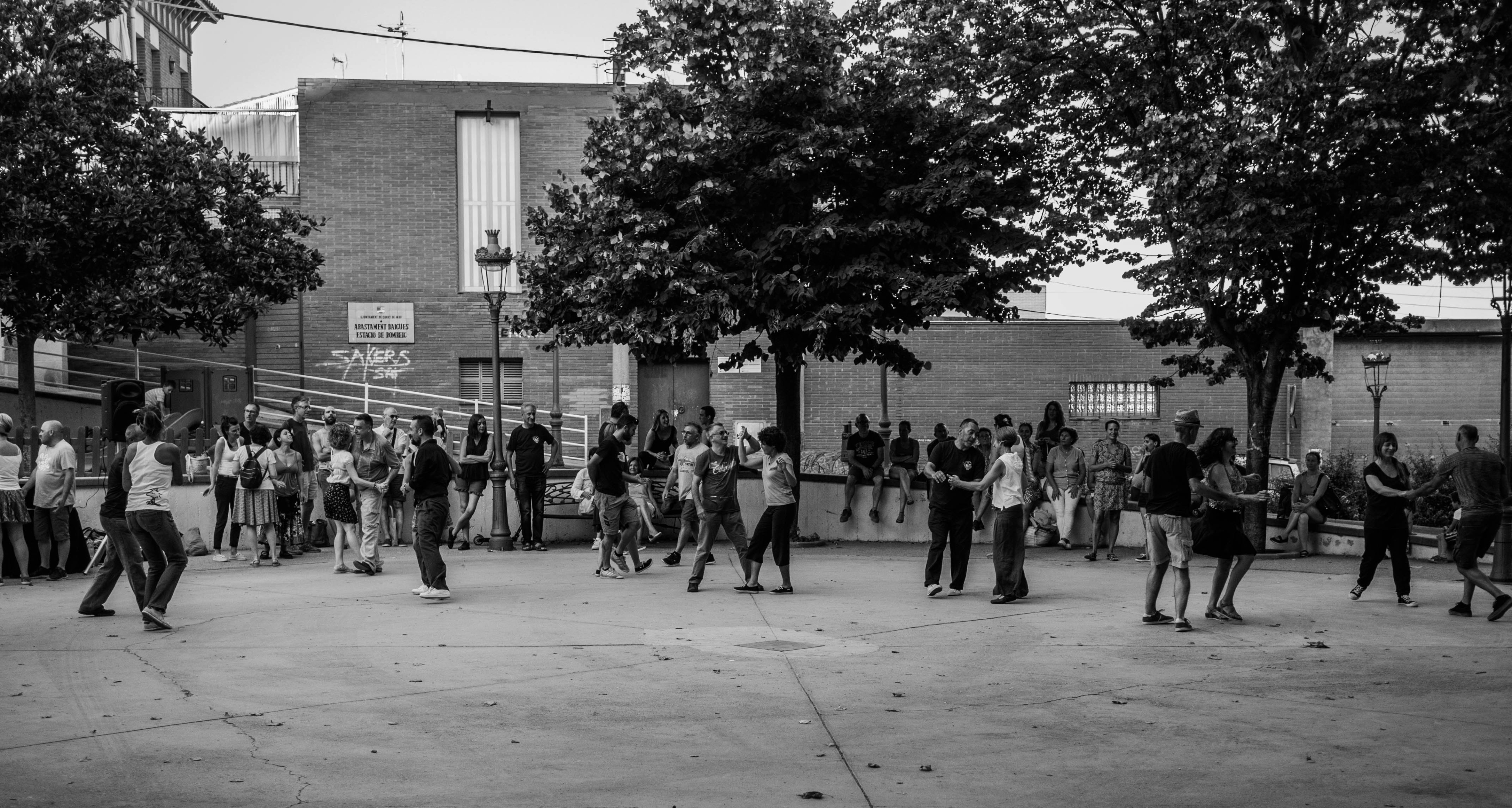 people dancing on square